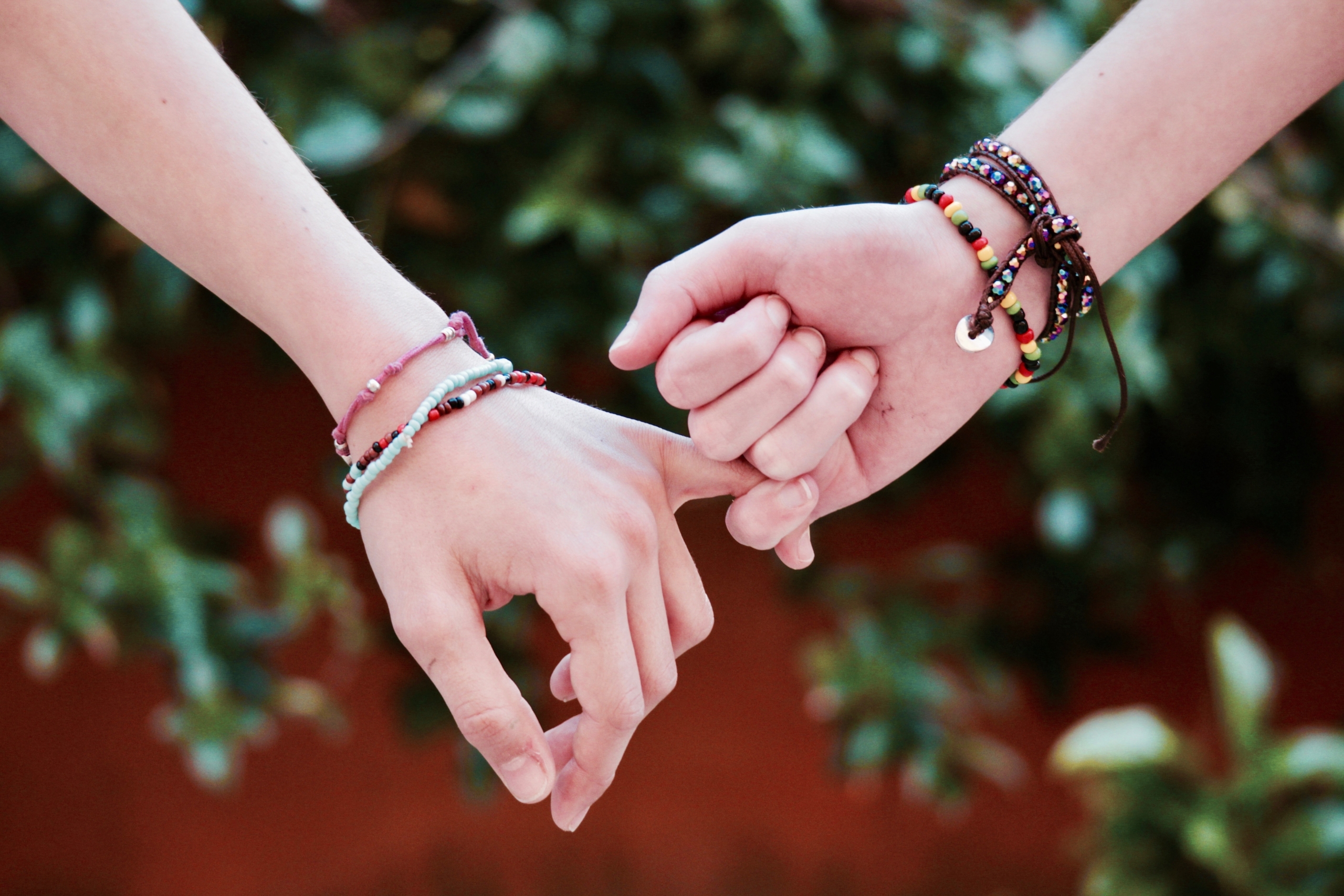 friendship - friends holding hands