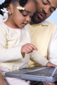 Father and Daughter on Computer