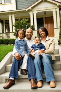 Family in Front of House